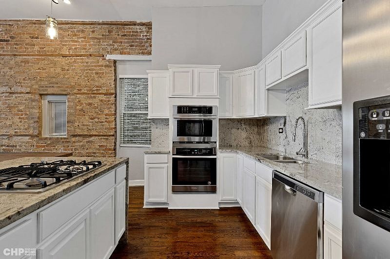 Kitchen area with Oven, Microwave, Stove, Dishwasher, and a full-size Fridge