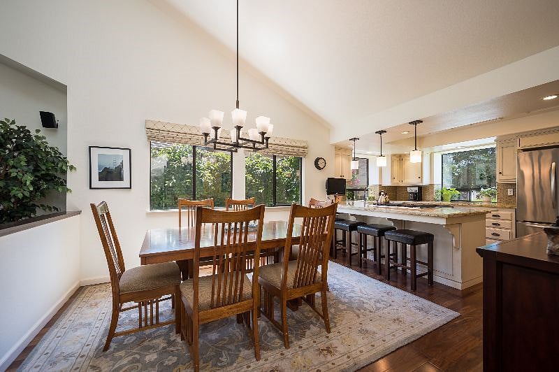 Dining/kitchen area open to
living room. Barstools for four; table seats 8.