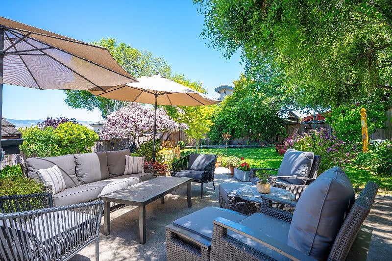 Enjoy a gorgeous backyard with quality outdoor furniture, large Weber gas grill, soothing garden fountain, vegetable garden and....views of San Luis Mountain.