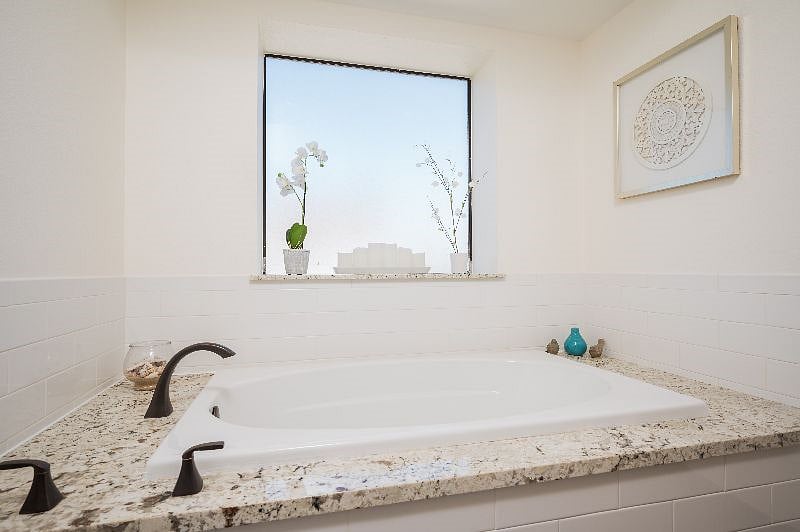 En suite bathroom has a heavenly, fills-fast deep soaker tub.
