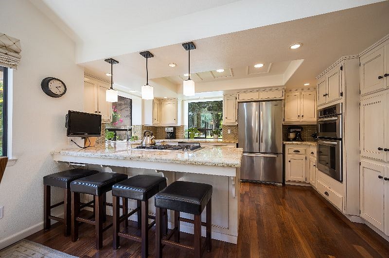 Cook's kitchen with bar seating. Gas range. Microwave, Full size coffee maker and Keurig; dishwasher; blender, food processor, all the tools you need.