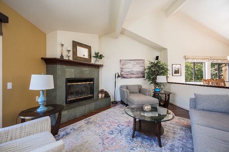 Living room includes woodburning fireplace