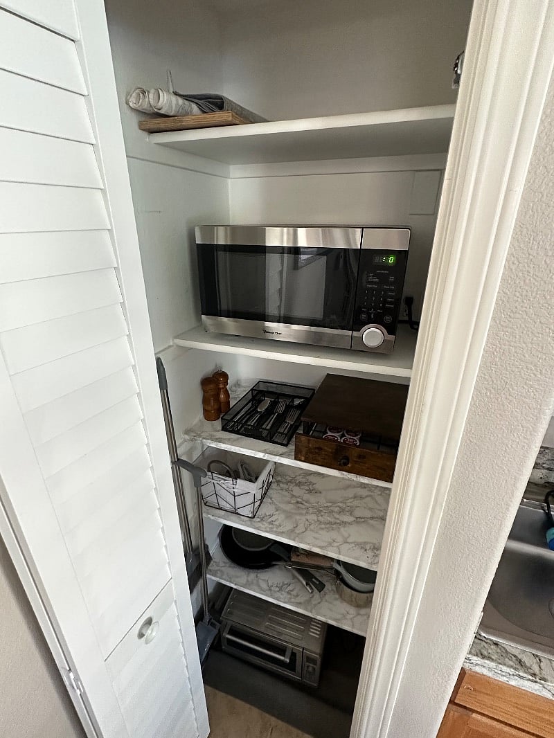 Microwave, toaster oven, silverware, measuring cups & spoons, etc.