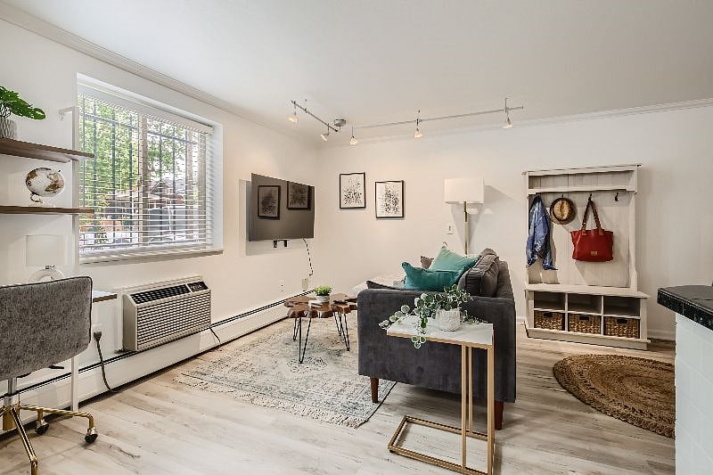 The bright and airy living room features all new, stylish furnishings and a large 55" smart TV with Roku for streaming your favorite movies and shows. There is also a dedicated workspace for your work from home needs!