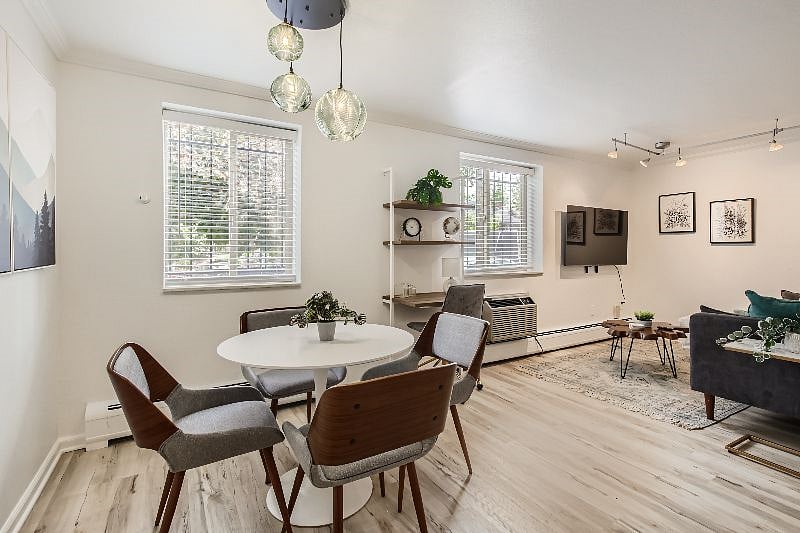 The bright and airy open concept dining and living area features brand-new, stylish furnishings and ample lighting throughout the space. Work from home at the dedicated workspace, the dining table, or the kitchen bar top for a standing option!