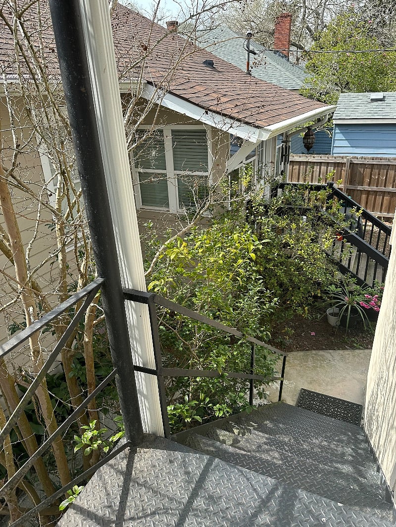 balcony stairs to garden and grill and storage garage for you..