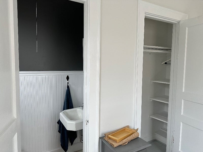 second half bathroom with closet with plenty of storage..