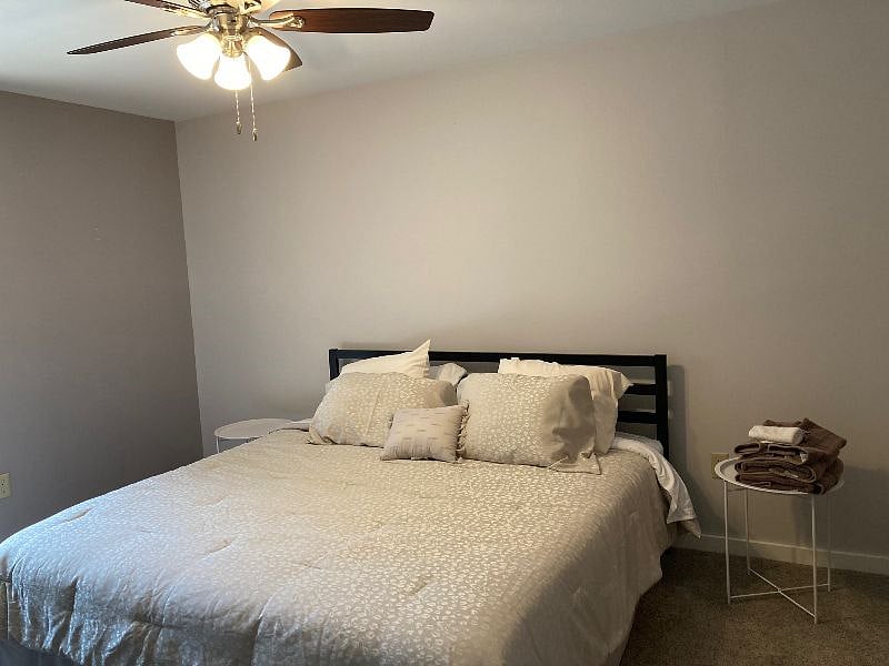 First ensuite bedroom. Has its own private bathroom and balcony/deck with storage unit.