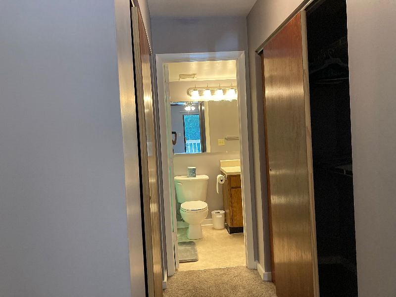 First ensuite bedroom. Has its own private bathroom and balcony/deck with storage unit.