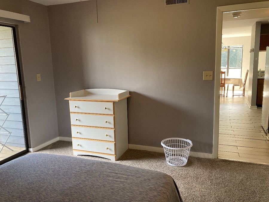 Second bedroom. Has its own private bathroom and balcony/deck with storage unit.