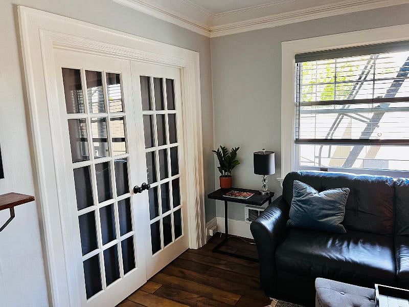 Privacy doors between the living room and bedroom
