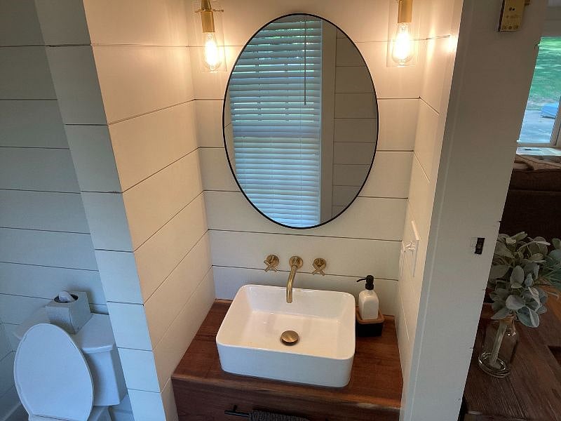 hidden powder room off of the main living area
