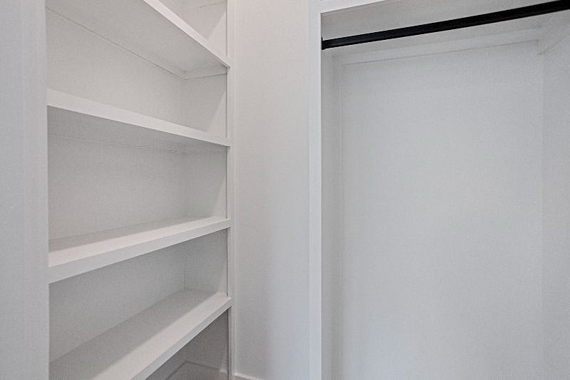 Entry coat closet oversized with additional storage.