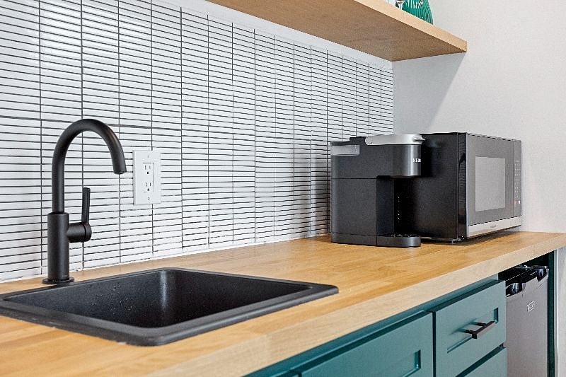 Stocked with a Keurig & Microwave with air-fryer capabilities.
