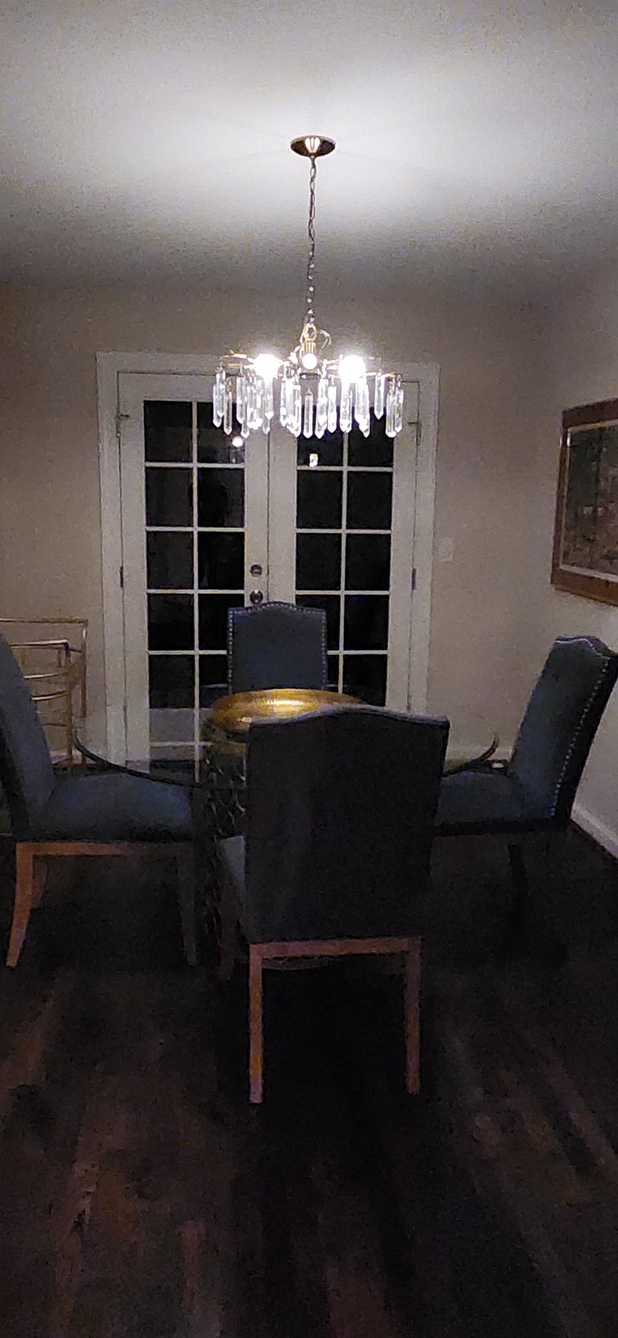 Dining room area with bar cart and tasteful high end artwork