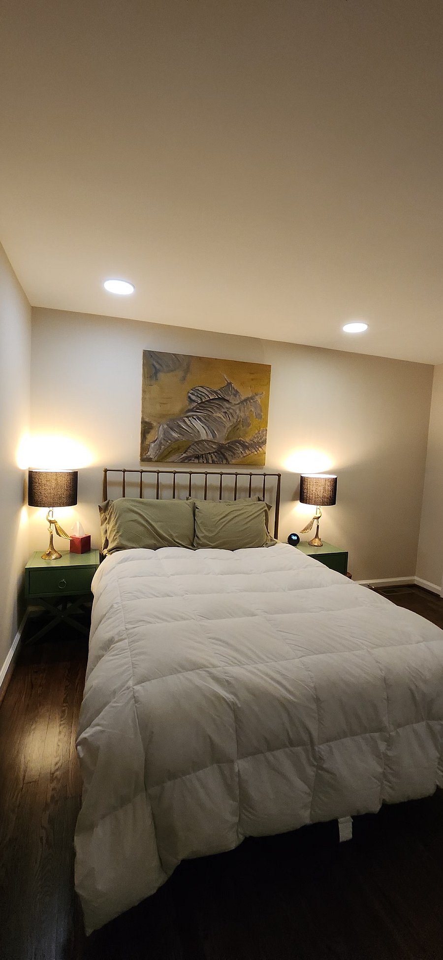 Comfortable primary bedroom with Lutron smart dimmers