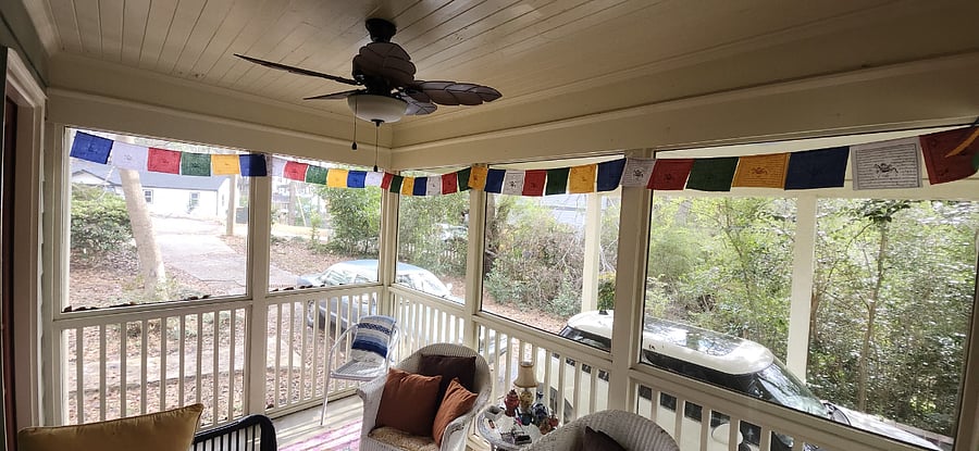 Screened porch with Tibetan prayer flags