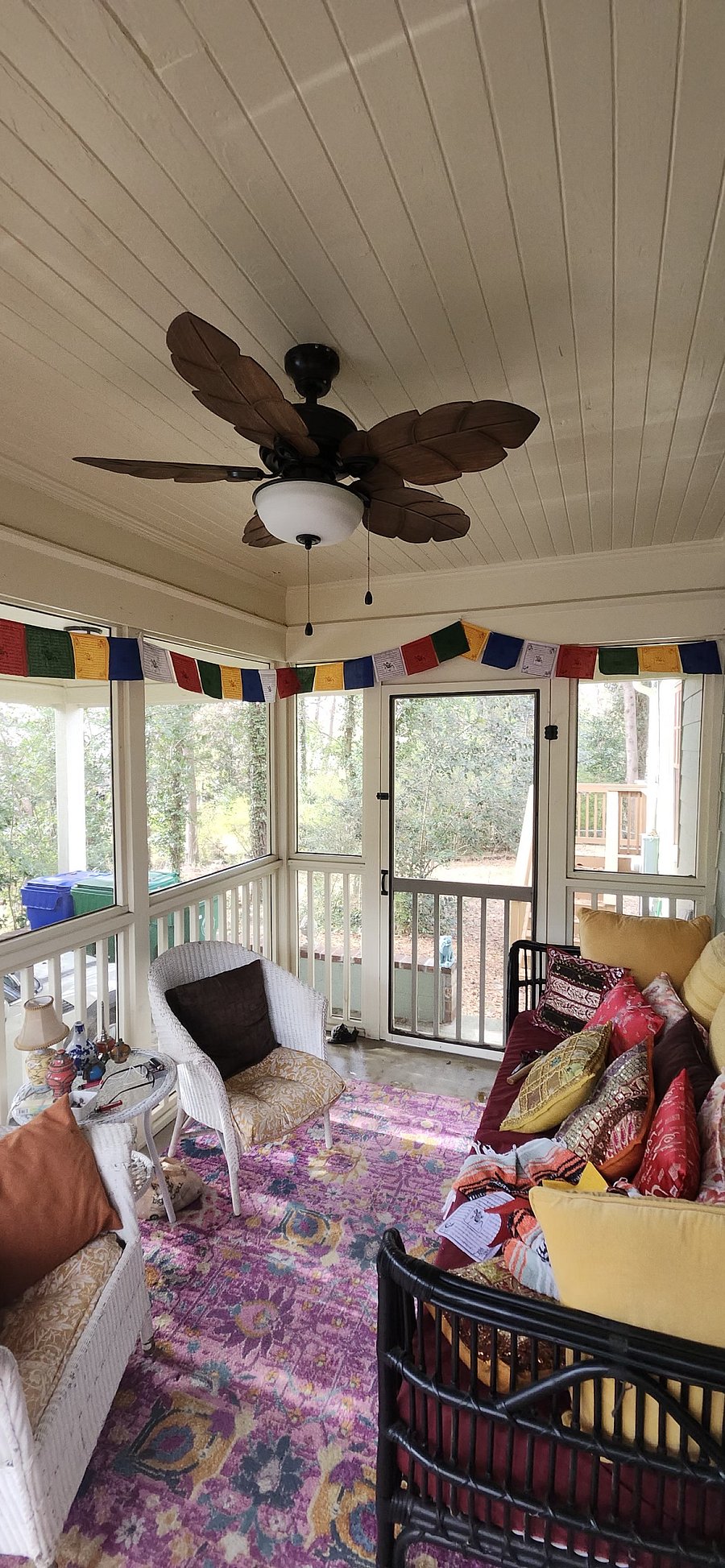 Screened porch with Tibetan prayer flags