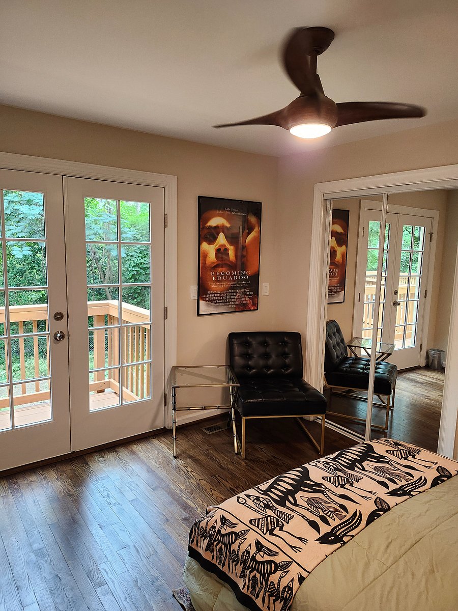 Guest Bedroom French doors to deck, and closet doors.