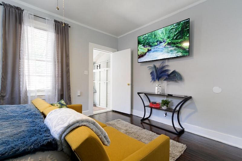 Secondary bedroom with 68" Smart TV
