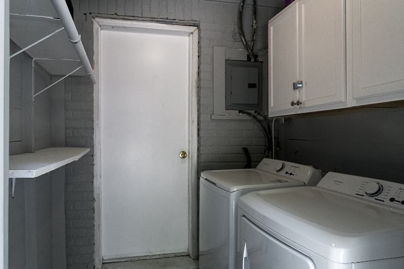 Laundry area with full size washer and dryer