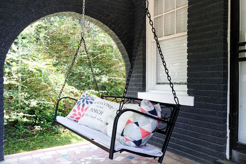 Enjoy the cars passing by while reading a book on this cozy swing on our front porch.
This is a shared space with adjacent unit.