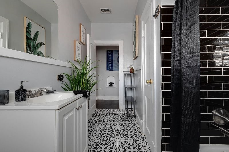 The luxuriously charming bathroom has all you need to unwind after the long day