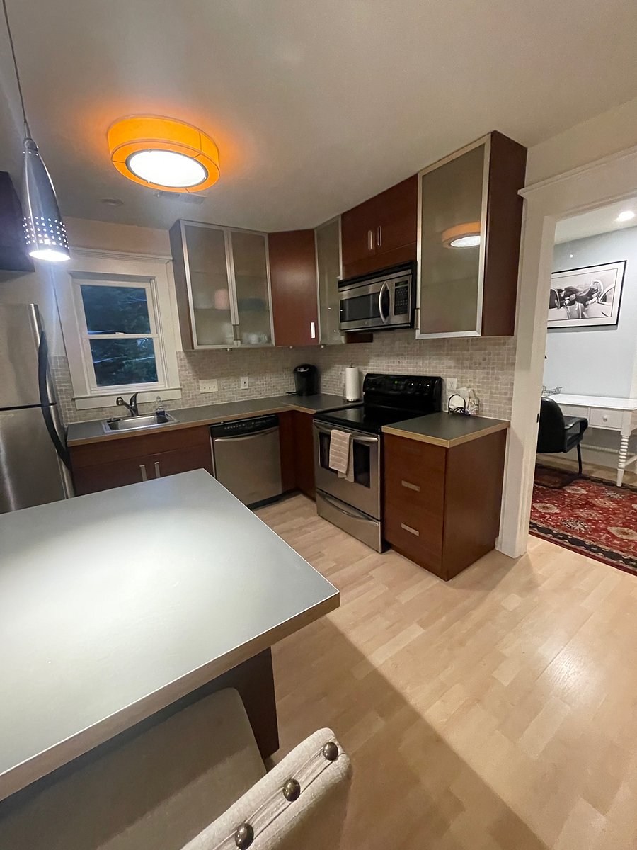 LARGE KITCHEN WITH FULL SIZE FRIDGE, DISHWASHER, STOVE AND MICROWAVE