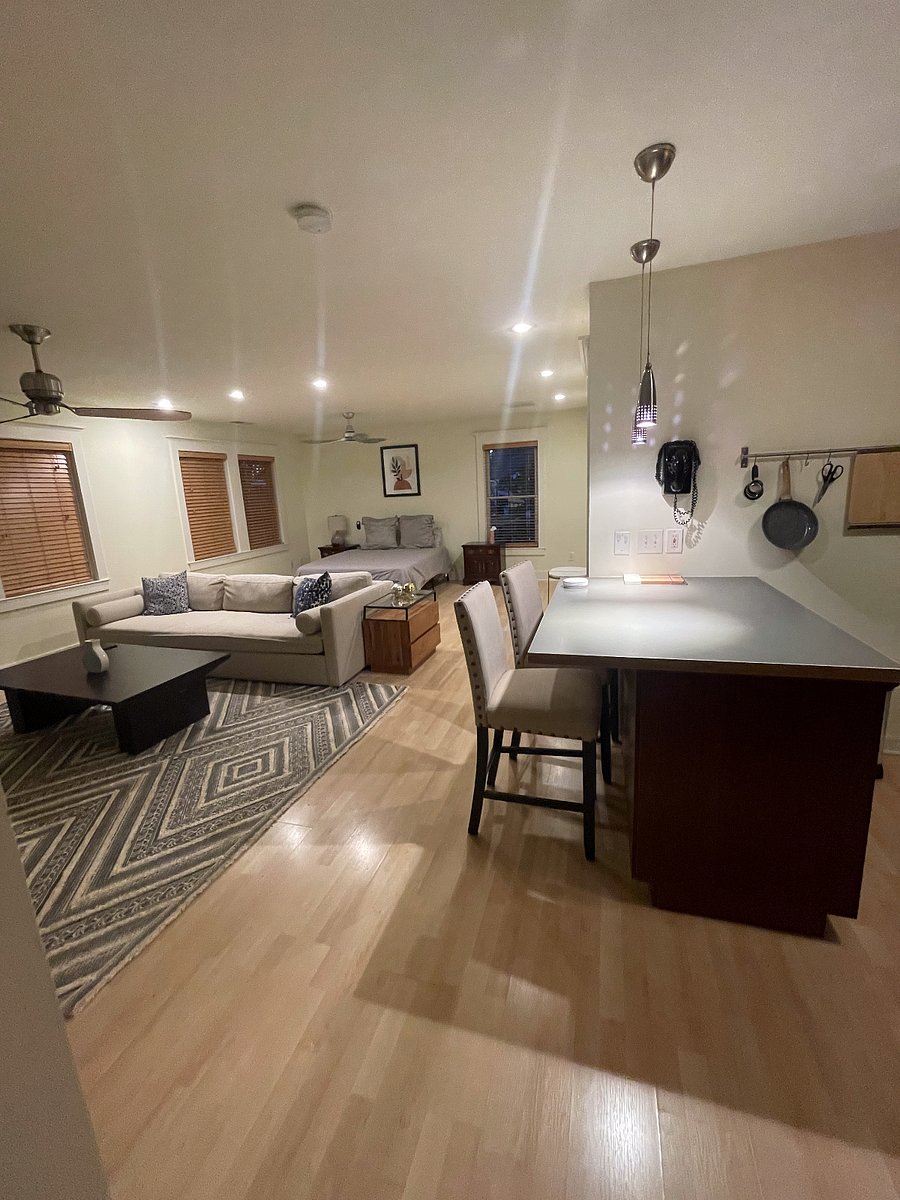 SPACIOUS LIVING AREA OPENS TO KITCHEN. Large comfy crate and barrel couch