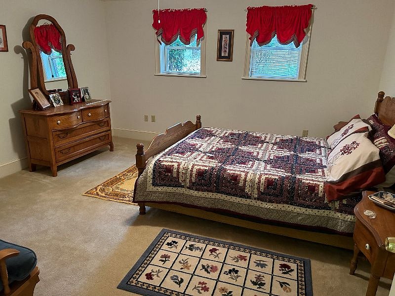 Queen bedroom with natural light.