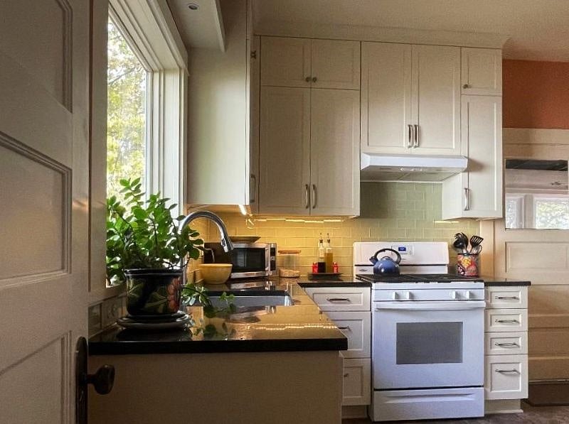 kitchen, gas range and vented hood