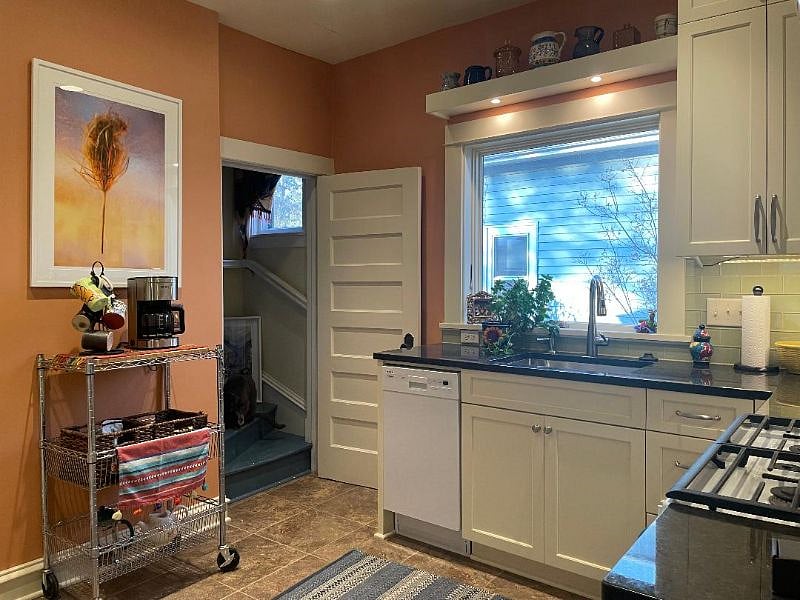 kitchen: sink, dishwasher, coffee station. garbage pullout under the sink.