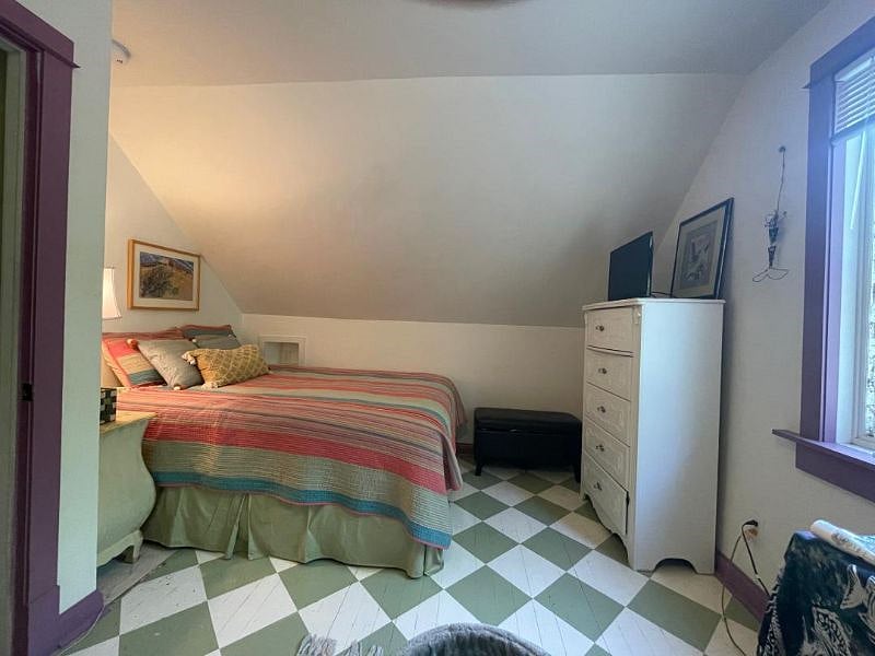 Front bedroom, tall dresser and small tv (local channels only). Extra linens are in the ottoman.