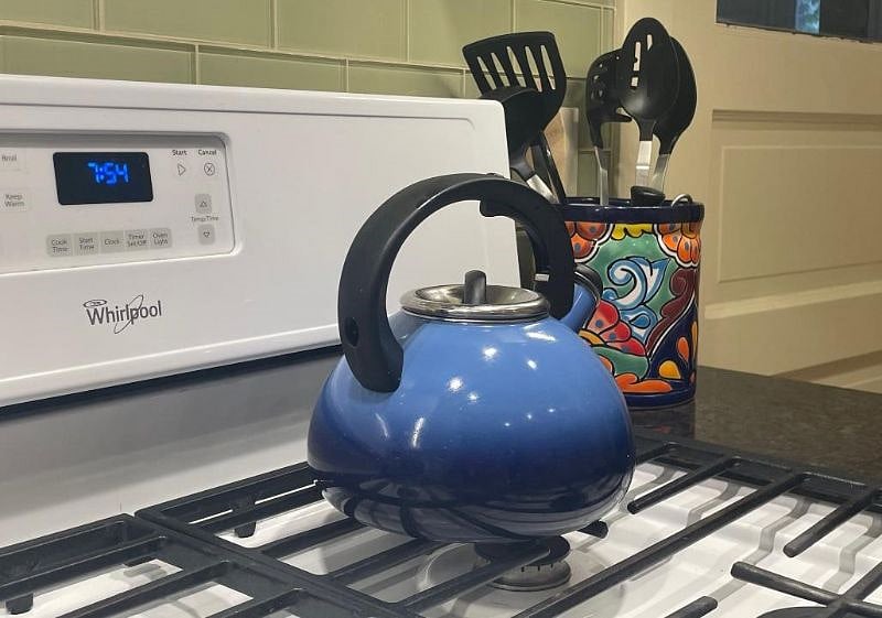 Kitchen: Gas range, teakettle, Talavera utensil holder