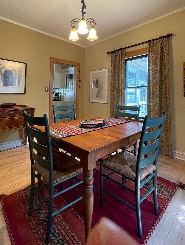 Dining Room, view to kitchen and back yard, facing east. I will remove knick-knacks to make room for your things!