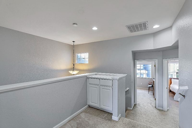 Head across the hallway to 2 additional rooms