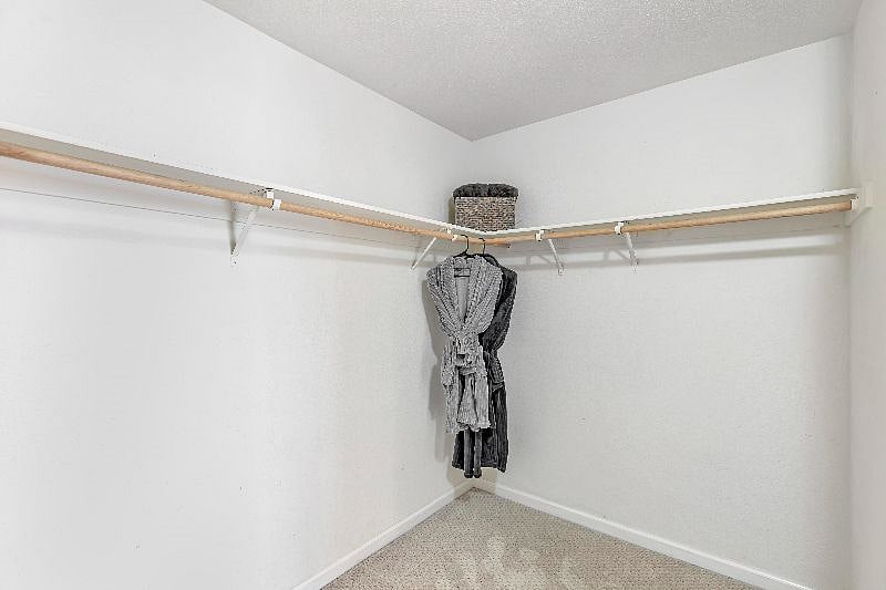 Stay awhile? Love to shop? This master bedroom spacious walk-in closet is a dream!