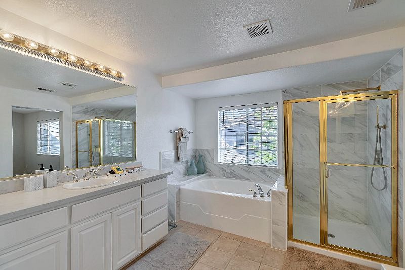 Master Bedroom bathroom equipped with standing shower and full tub