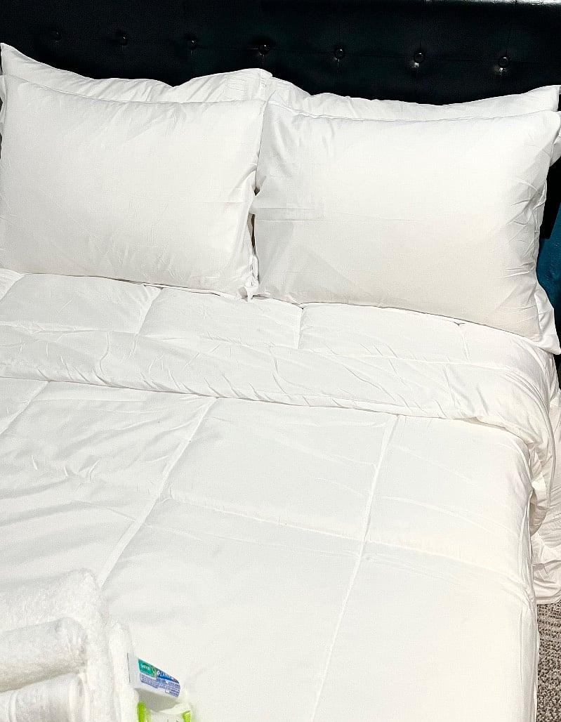 Hotel style comforter and pillows.