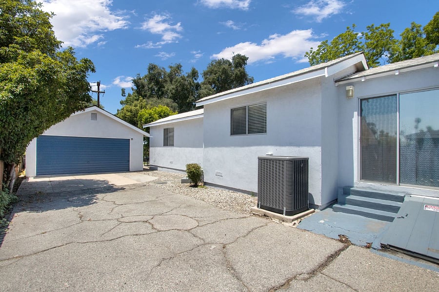Large driveway: back door access to garage.