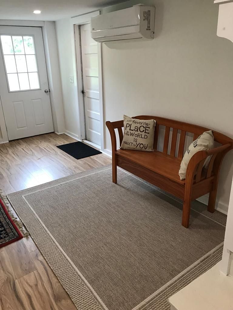 first floor entrance and bench