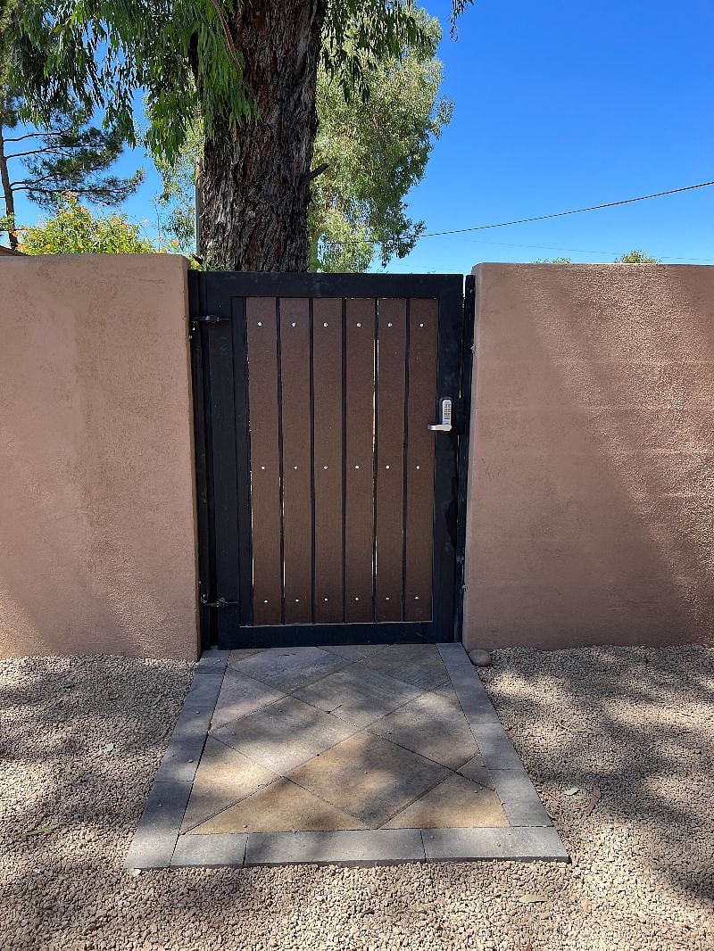 Keyless locked gate entry to property