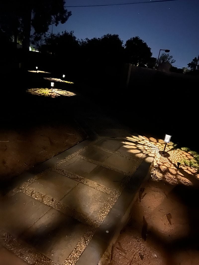 Lit pathway to guest home.