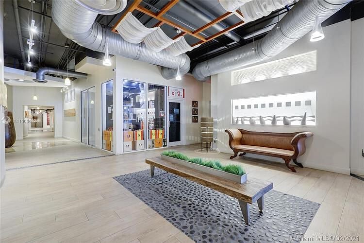 Hallway leading to authentic Spanish restaurant, mailroom, elevators, and dog park.