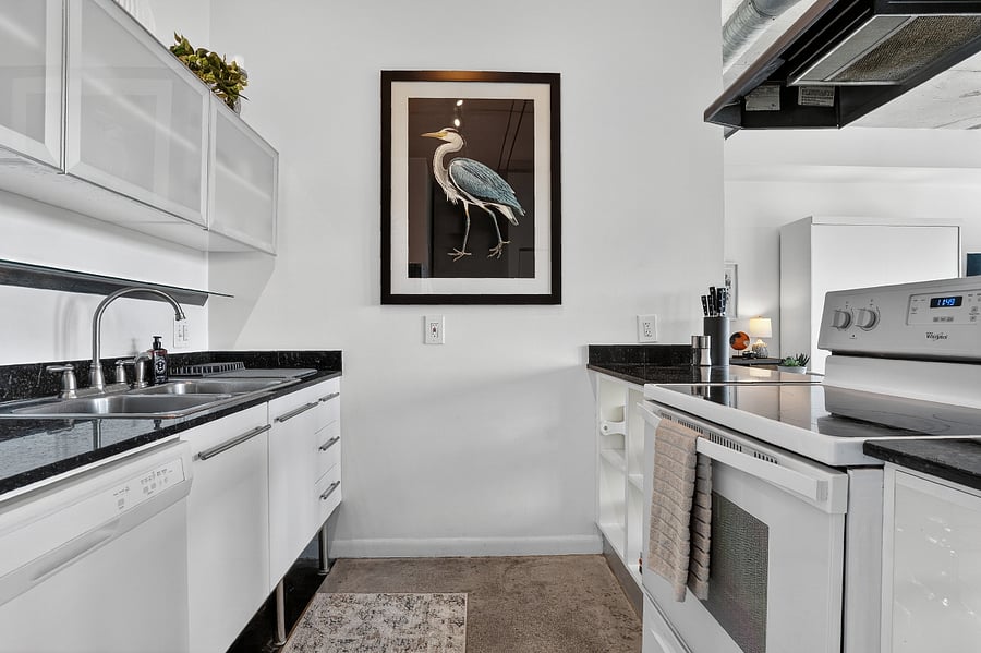 Full kitchen with ample storage and stocked with everything you need to cook your favorite meals. Pots, pans, mixing bowls, cast iron skillet, and more.