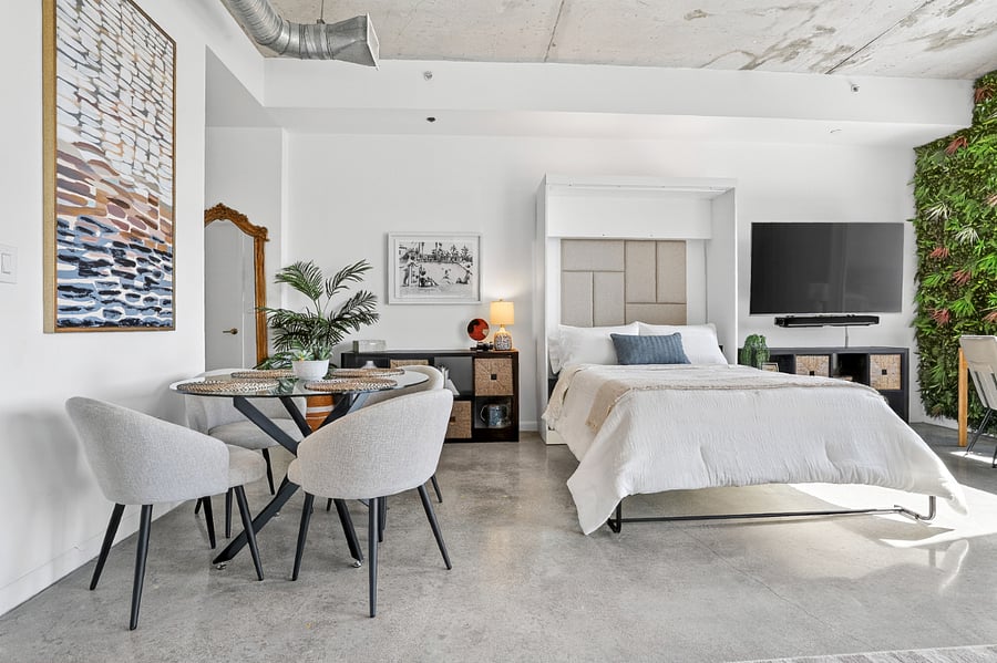 Full size Murphy bed for guests that is extremely easy to operate with built in, flip down, leg system.