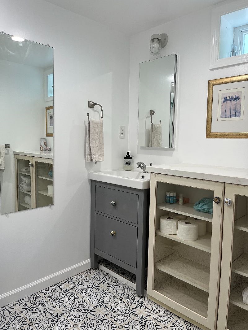 Spacious bathroom with good lighting and ample counter space