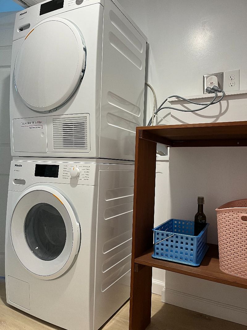 Laundry room with Miele washer and dryer