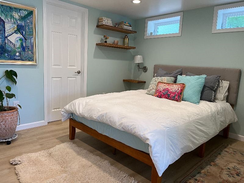 Well appointed bedroom with comfortable organic bedding and plenty of reading light.