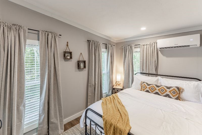 Bedroom 1: Queen bed with black out curtains, soft linens, and extra blankets.  